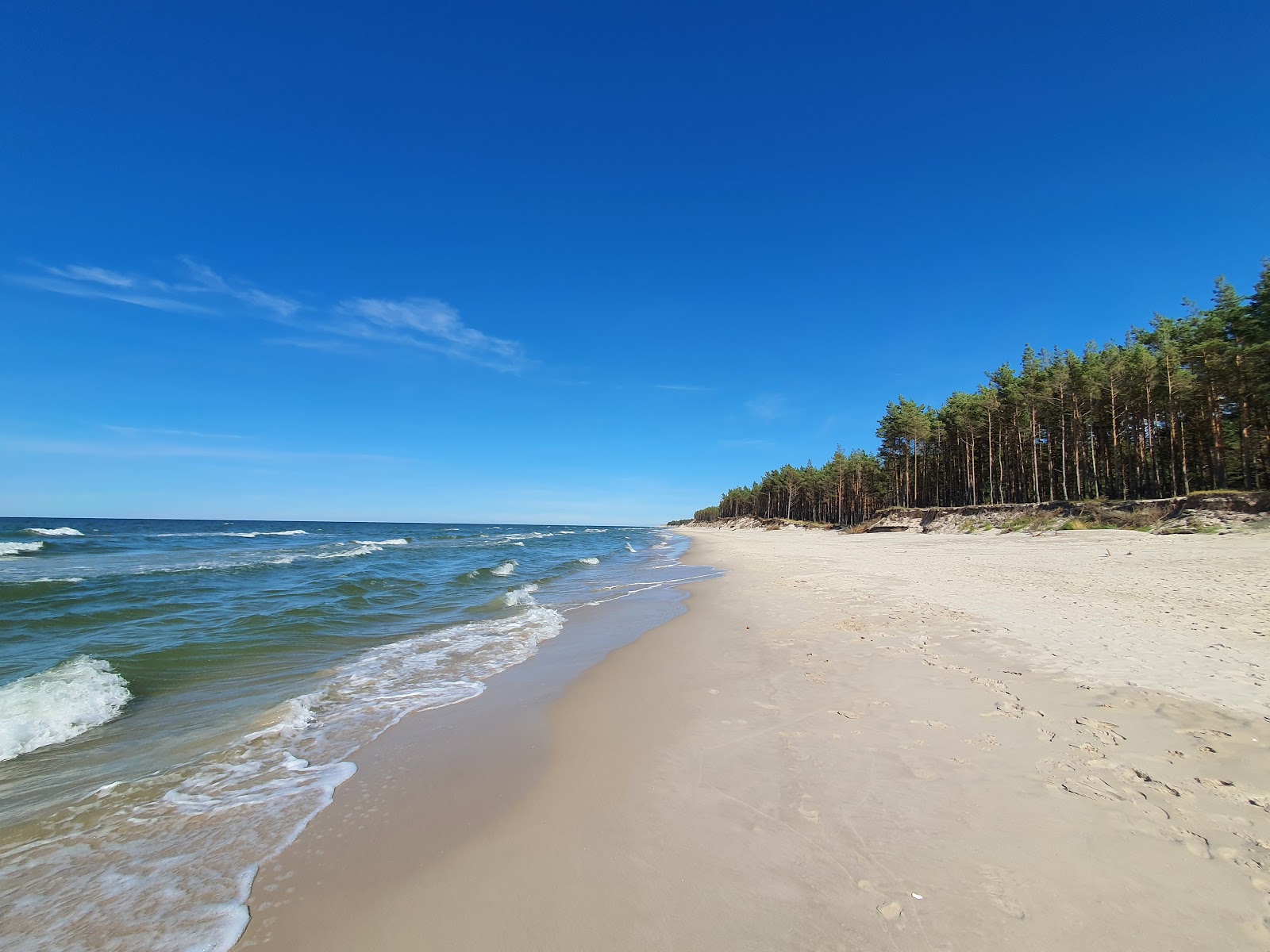 Photo of Ulinia Beach with white fine sand surface