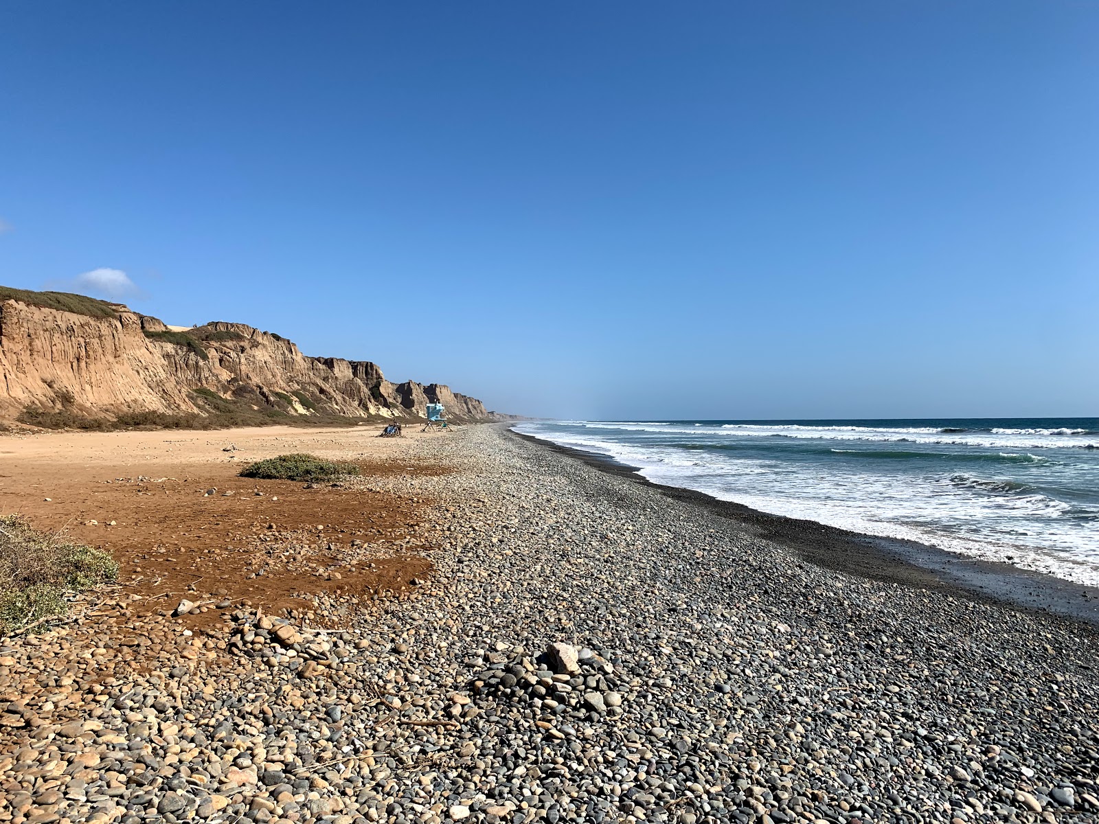 Gladiator beach的照片 带有轻质沙和卵石表面