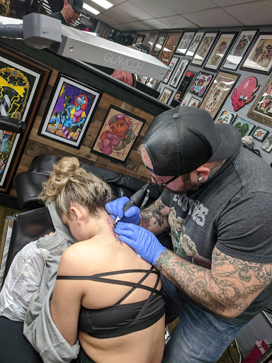 Explore chanel tattoo ideas, creative tattoo ideas in Cabot, available at ELECTRIC PANTHER TATTOO GALLERY