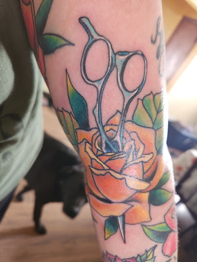 Explore smile tattoo ideas, creative tattoo ideas in Powell, available at Hummingbird Tattoo Studio