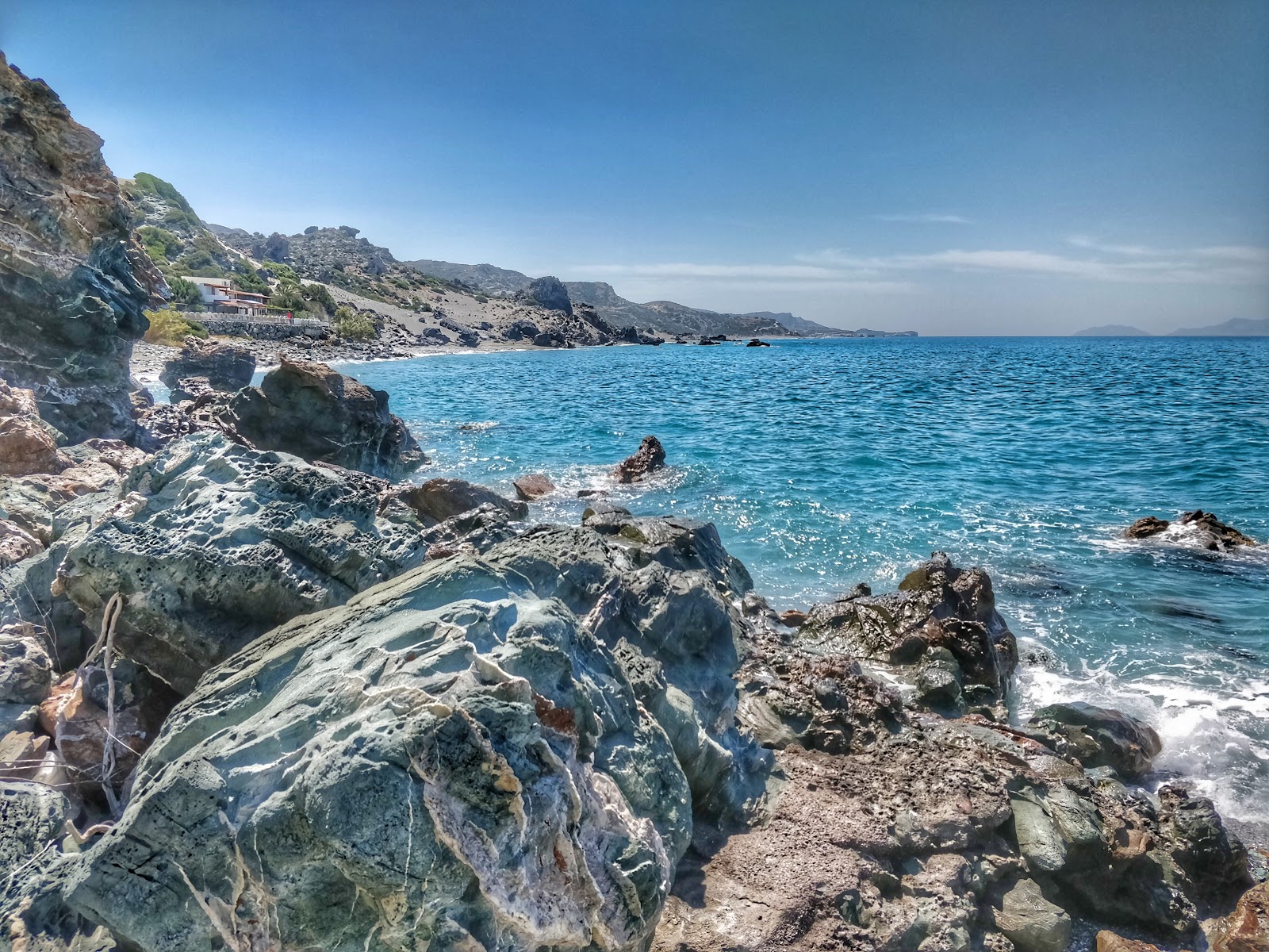 Foto av Podare beach med turkos rent vatten yta