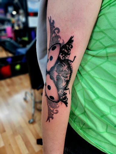 Explore tattoo cover up ideas for women, creative tattoo ideas in Benton, available at Spectrum Tattoo