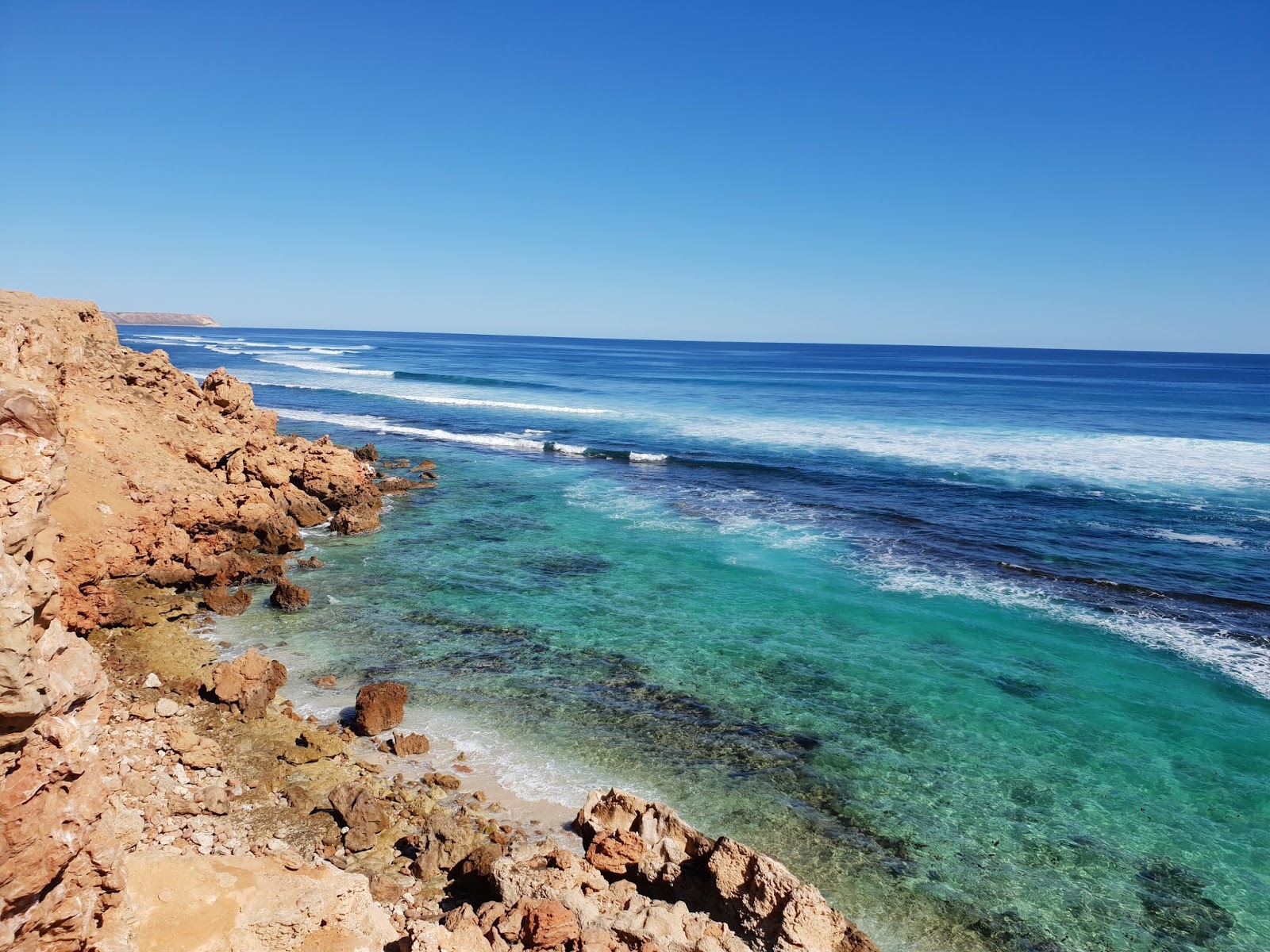 Foto von Gnaraloo Turtle Beach mit beiger sand & steine Oberfläche