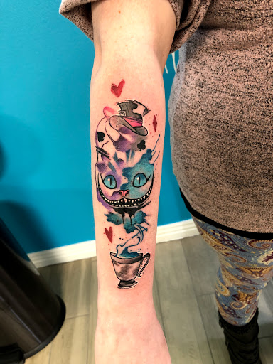 Explore book tattoos ideas, creative tattoo ideas in Springdale, available at Tattoo Cartel