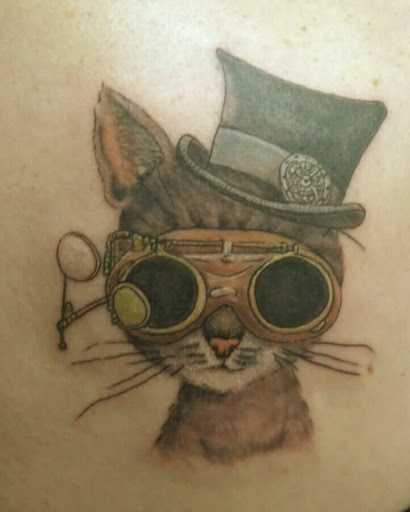 Explore flower spine tattoo ideas, creative tattoo ideas in Huntsville, available at The Purple Goat Tattoos