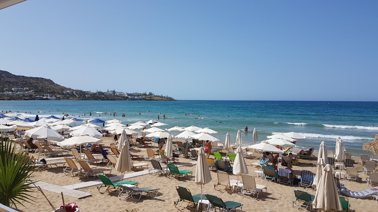 Photo of Stalis beach with blue pure water surface