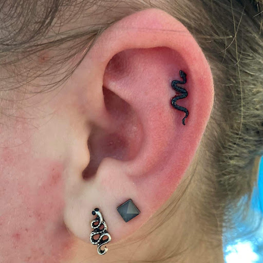 Find tattoo ideas for men music for your next unique tattoo in Nampa at Hippie Hoops and Holes