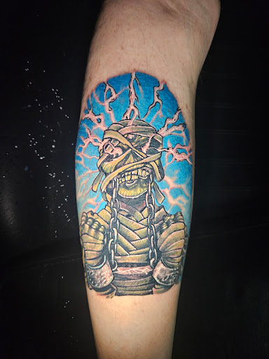 Explore female dragon tattoo ideas, creative tattoo ideas in Angola, available at Hoodlum Ink