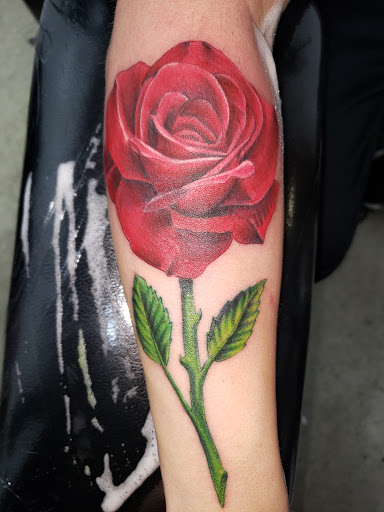 Explore lilac tattoo ideas, creative tattoo ideas in Sioux Falls, available at Outlaw Tattoos