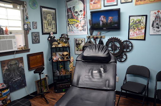 Explore small dinosaur tattoo ideas, creative tattoo ideas in Calhoun, available at A Sailors Grave Tattoo Parlor