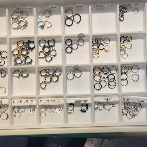 Explore wrestling tattoo ideas, creative tattoo ideas in Buena Park, available at Lucky Body Jewelz