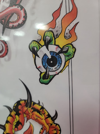 Explore knowledge tattoo ideas, creative tattoo ideas in Pigeon Forge, available at Black Orchid Tattoo Studio