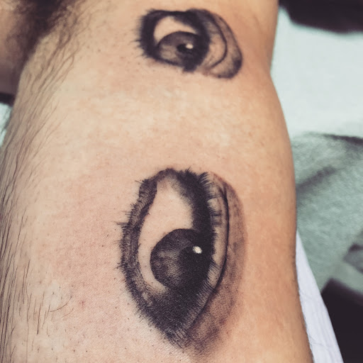 Find small palm tree tattoo ideas for your next unique tattoo in Arlington at Lady Octopus Tattoos