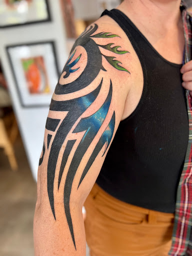 Explore dark skin male black skin tattoo ideas, creative tattoo ideas in Fairfax, available at The Forge Tattoo