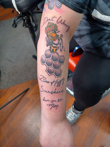 Explore dog tattoo ideas for men, creative tattoo ideas in Danville, available at Dark Horse Tattoo and Piercing