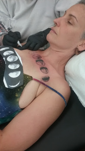 Explore behind ear tattoo ideas for guys, creative tattoo ideas in Fort Wayne, available at Dark Horse