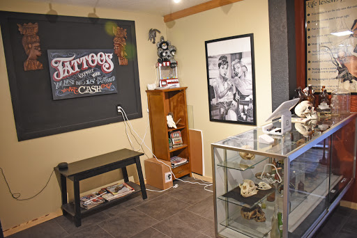 Explore wolf neck tattoo ideas, creative tattoo ideas in Knoxville, available at Chasing Dreams Tattoos