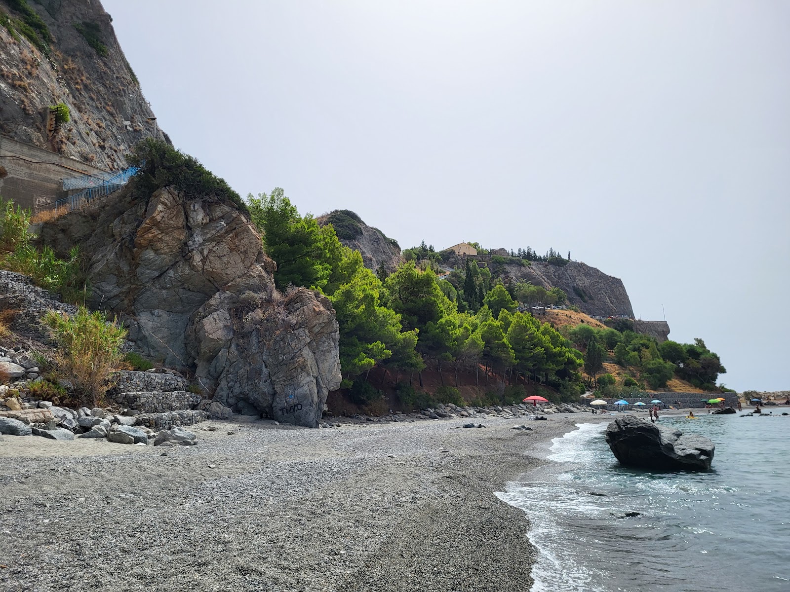 Photo de Rocca del Capo Beach avec un niveau de propreté de assez propre