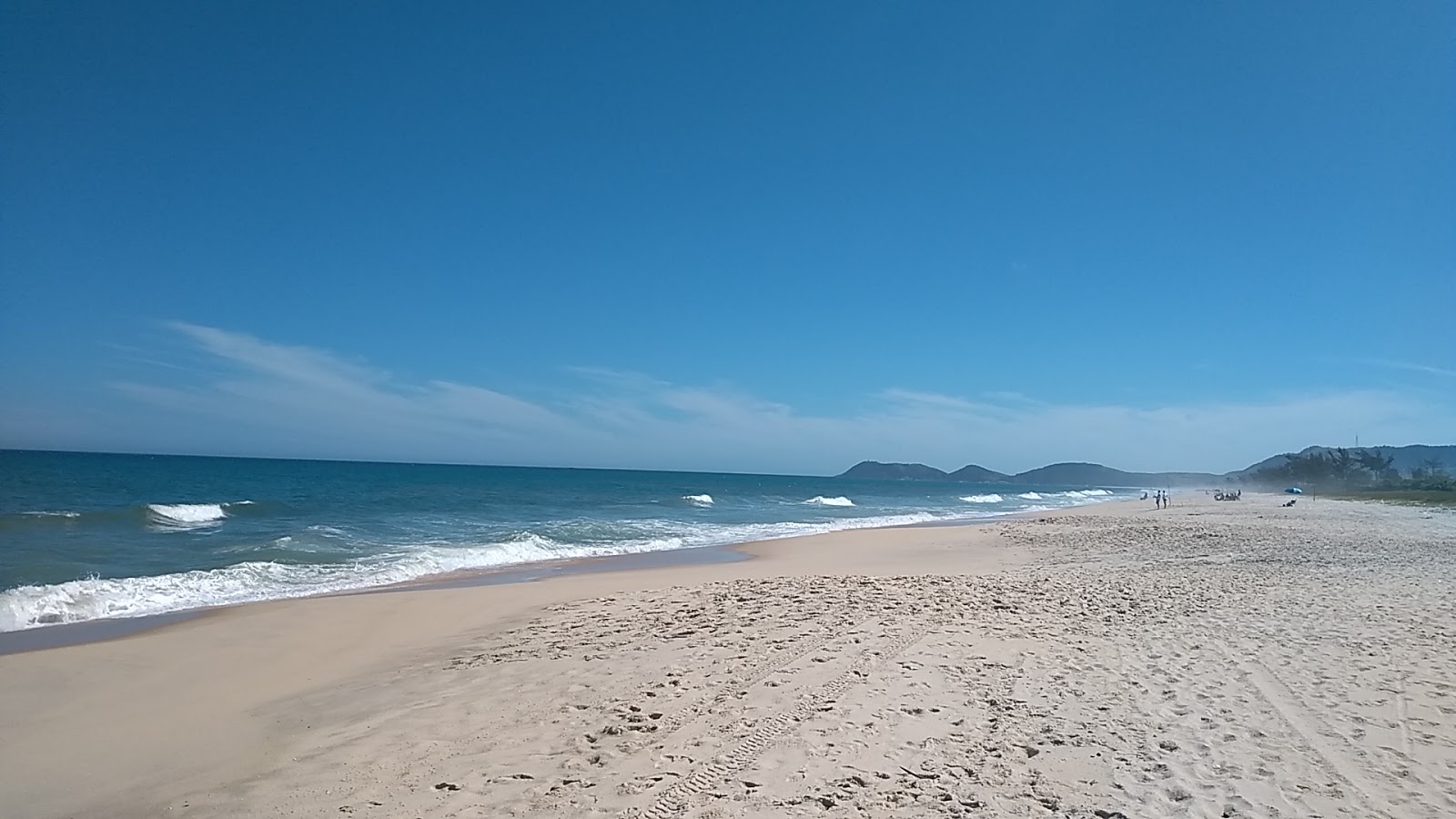 Foto van Praia de Jacone II met helder fijn zand oppervlakte