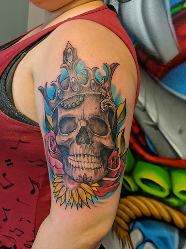 Explore bookworm tattoo ideas, creative tattoo ideas in Elko, available at Iron Anchor Tattoo