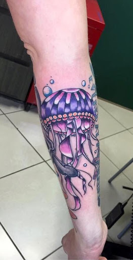 Explore iris flower tattoo ideas, creative tattoo ideas in Meridian, available at Creative Pain Tattoo Studio