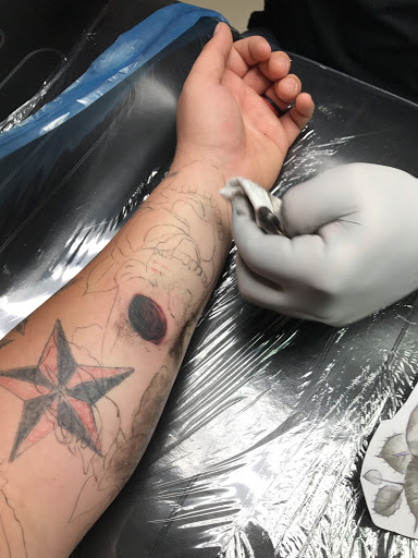 Explore hand tattoo ideas man, creative tattoo ideas in Windsor, available at Spillen Ink