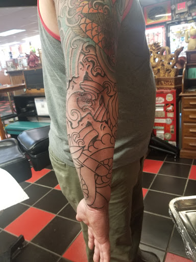 Find time clock tattoo ideas for your next unique tattoo in Milwaukee at Atomic Tattoos