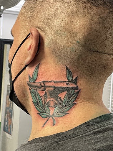 Explore neck tattoo ideas for men, creative tattoo ideas in Albuquerque, available at Holy Fool Tattoo Club