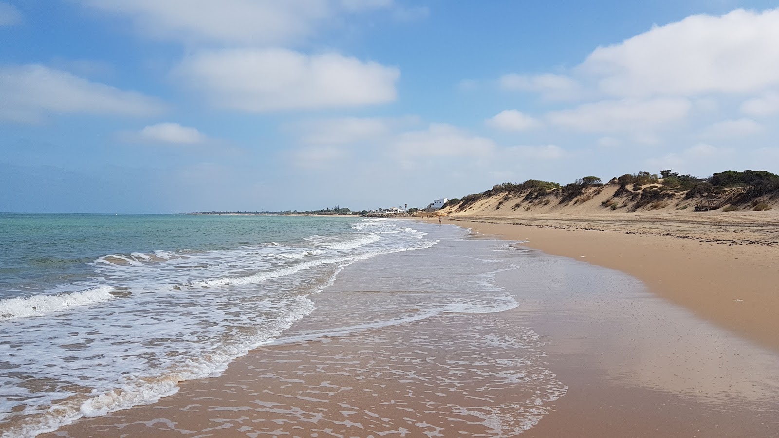 Foto av Playa de Punta Candor med lång rak strand