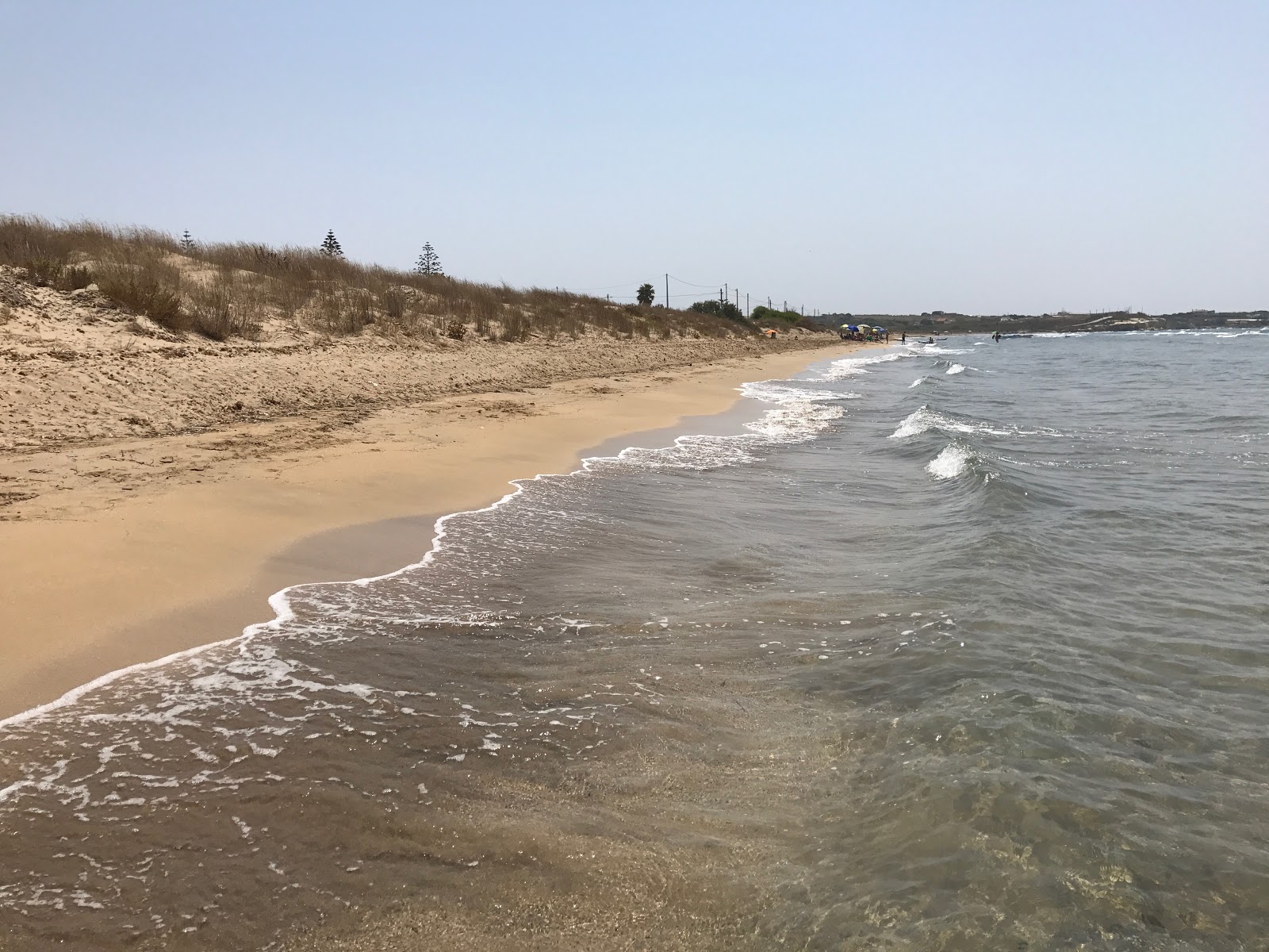 Fotografie cu Spiaggia Scarpitta cu o suprafață de apa pură turcoaz