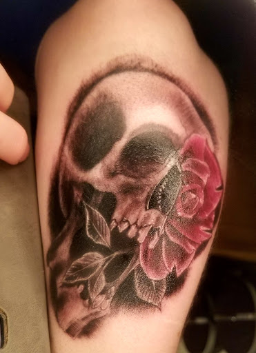 Explore tattoo ideas for top of leg, creative tattoo ideas in Marietta, available at Sink or Swim Studio and Gallery