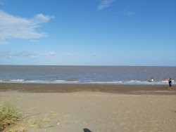 Salado Beach'in fotoğrafı geniş bir kıyı şeridi ile birlikte