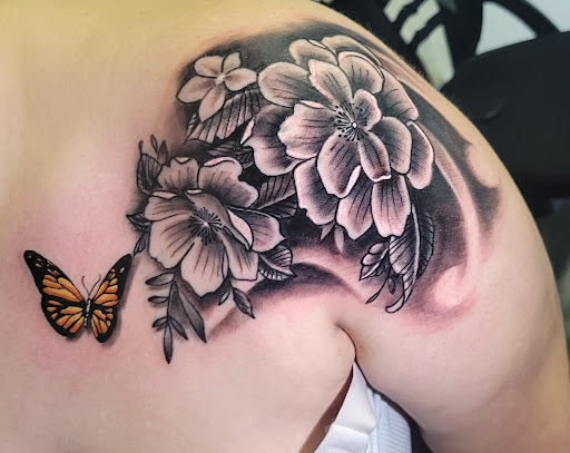 Explore viking head tattoo ideas, creative tattoo ideas in Angola, available at Hoodlum Ink