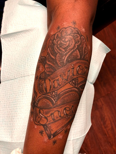 Explore family tattoo ideas for dads, creative tattoo ideas in Seymour, available at American Gypsy Tattoo Corp.