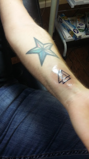 Explore red tattoo cover up ideas, creative tattoo ideas in Benton, available at Relics Tattoo Studio