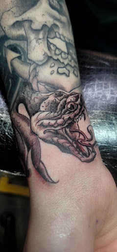 Explore dog tattoo ideas for men, creative tattoo ideas in Yakima, available at Wallflower Body Piercing & Crazy Ink Tattoo