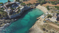 Spiaggia di Porto Ghiacciolo'in fotoğrafı küçük koy ile birlikte