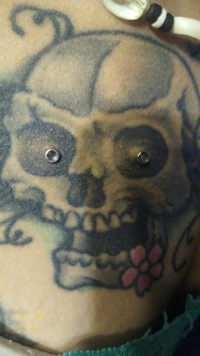 Explore tattoo fill in ideas for men, creative tattoo ideas in Plattsburgh, available at One Flight Up Body Piercing