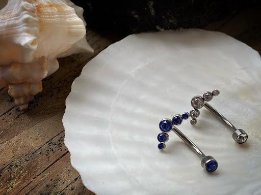 Explore leg tattoo ideas black male, creative tattoo ideas in Cary, available at Fine Art Body Piercing By Lilith Mae