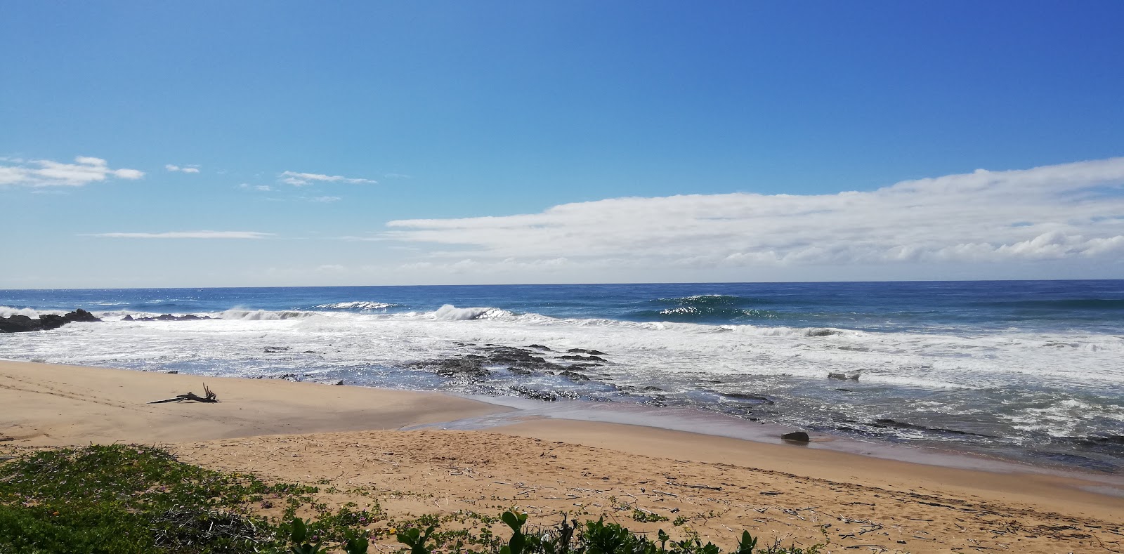 Foto de Hibberdene beach con arena beige superficie
