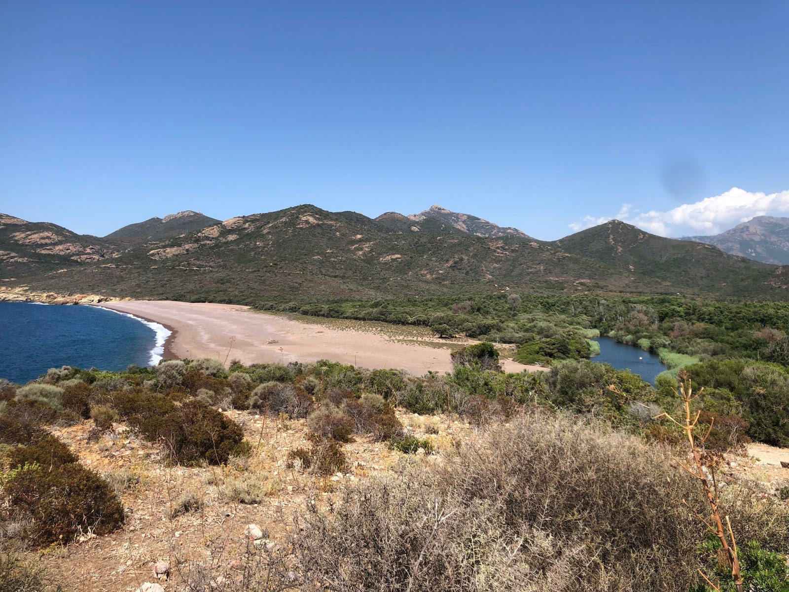 Photo of Fango beach with turquoise pure water surface