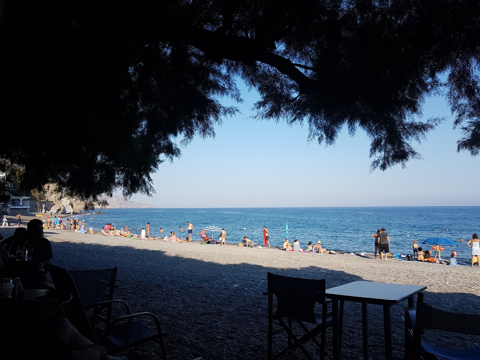 Photo of Three Churches beach and the settlement