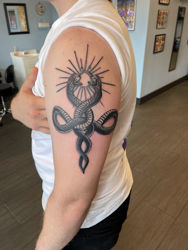 Explore carnage tattoo ideas, creative tattoo ideas in Palm Harbor, available at Angry Owl Tattoo and Piercing