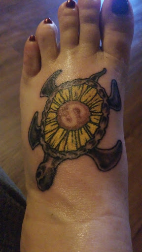 Explore cover up lower back tattoo ideas, creative tattoo ideas in Bryson City, available at Donnos Higher Ground Tattoo