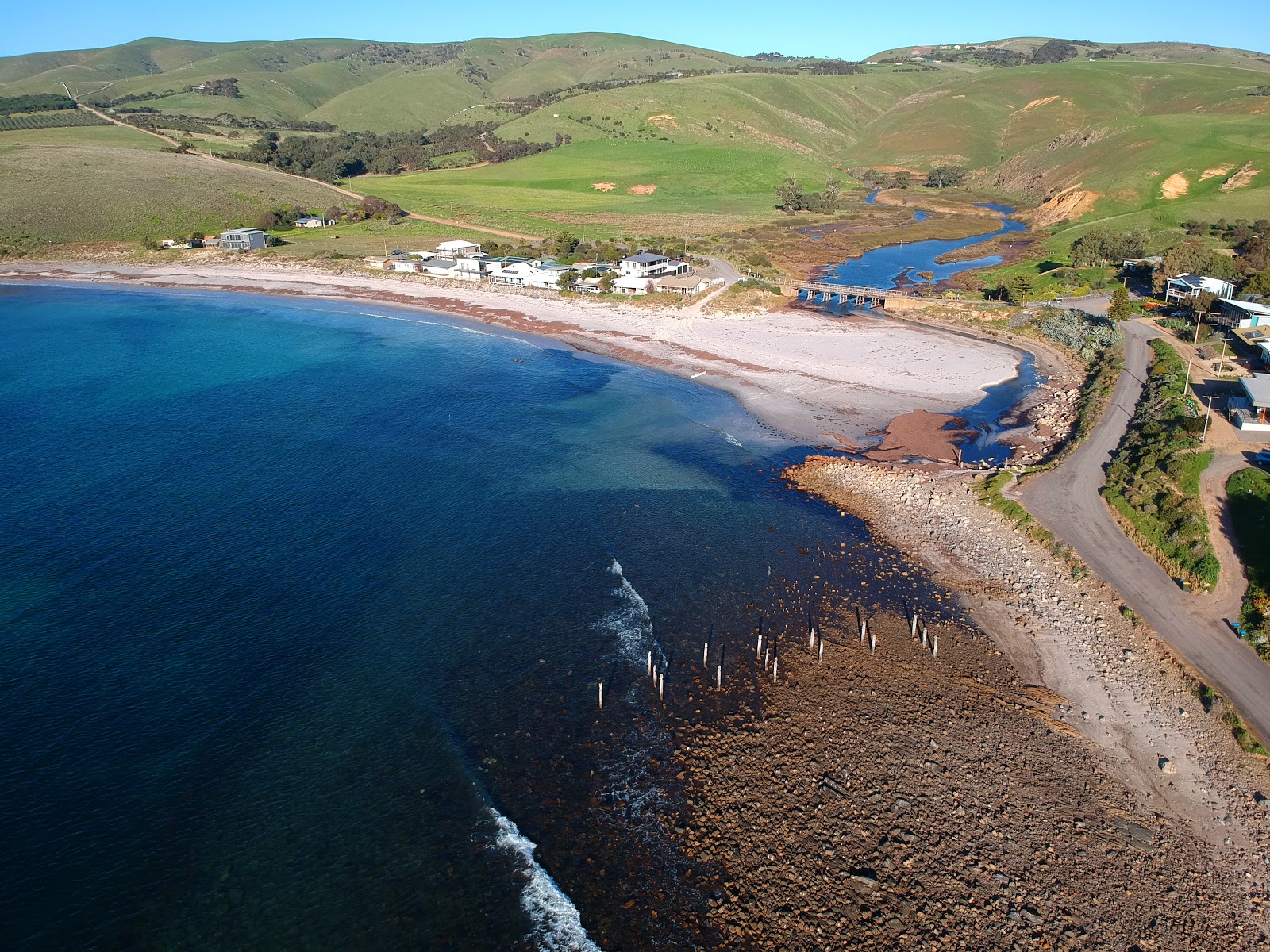 Photo of Myponga Beach backed by cliffs
