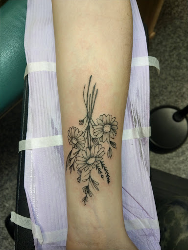 Explore upper arm tattoo ideas for women, creative tattoo ideas in Saint Paul, available at Iron Rhino Tattoo