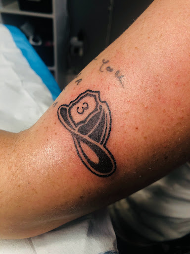 Explore spine tattoo ideas male, creative tattoo ideas in North Tonawanda, available at Dark Side Ink Tattoo Studio