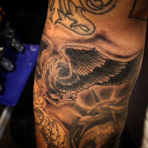 Explore charm tattoo ideas, creative tattoo ideas in Gadsden, available at Sacred Art Tattoo Company