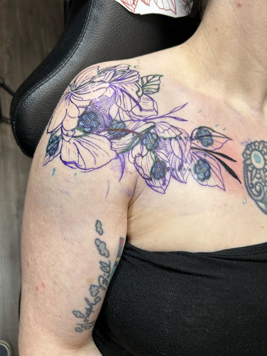 Find in between breast tattoo ideas for your next unique tattoo in Wasilla at Doulos Tattoo, The Tattoo Shop