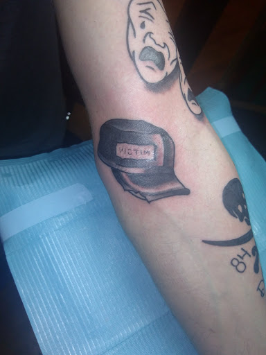 Explore manly tattoo ideas, creative tattoo ideas in Albany, available at Dead Presidents Lounge